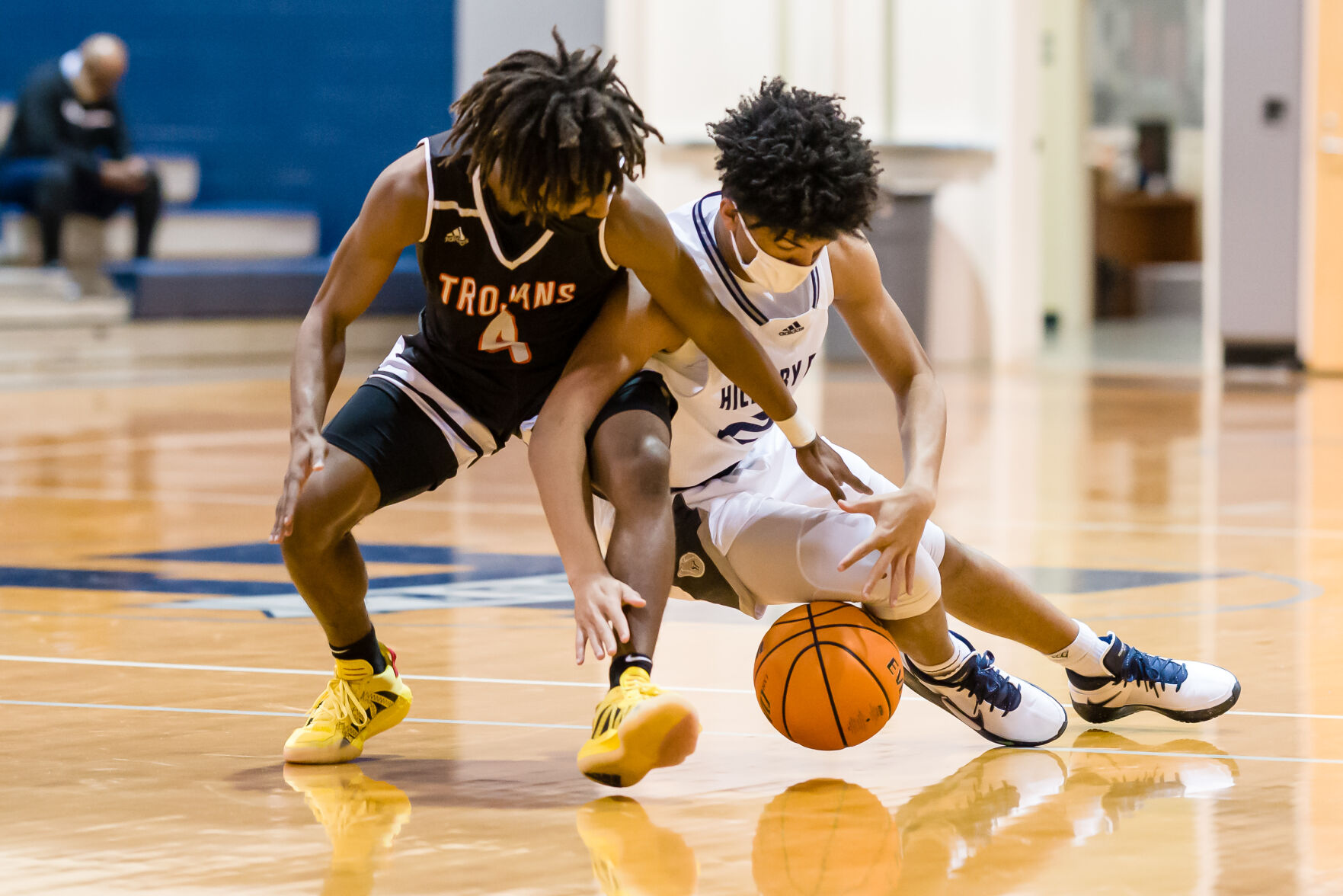 Boys Basketball: Hickory Ridge RaginÕ Bulls defeated the Northwest Cabarrus Trojans 64-56.